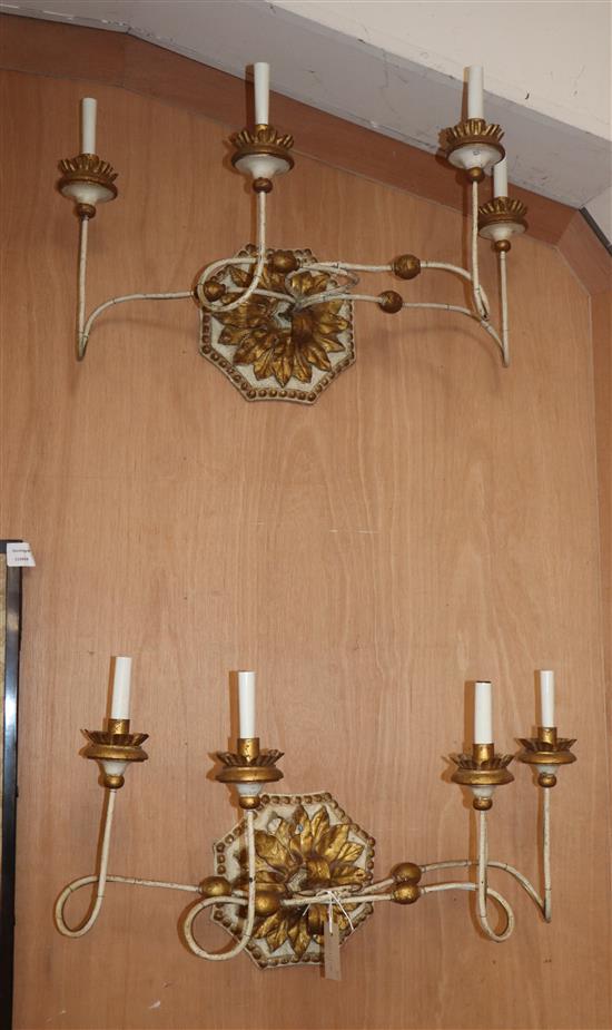 A pair of four light parcel gilt and cream wall brackets W.66cm